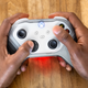 A bright LED on each battery makes a gamer’s hands glow red when the battery is nearing depletion.